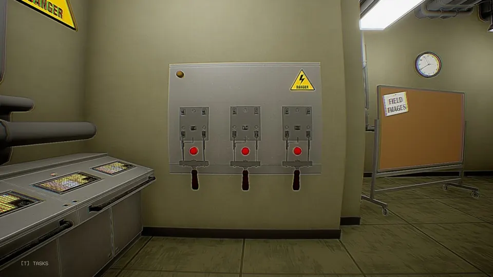 One of the two switch panels, three lever switches under a danger sign, with the Field Images board in the background