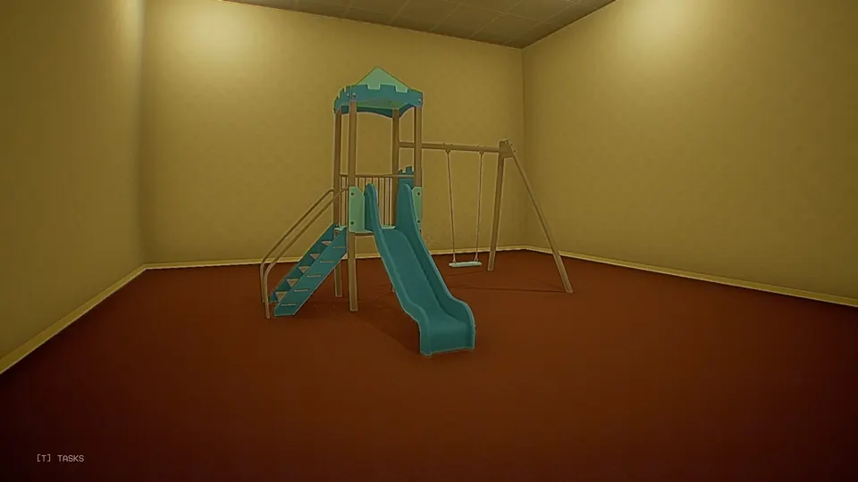 A playground set with a blue slide and swings on red carpet
