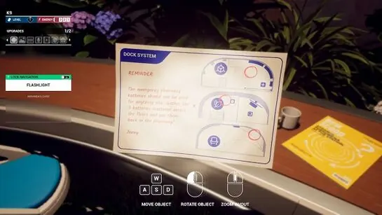 The Dock System reminder card on the Kitchen desk, showing three battery slots