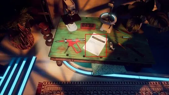 A loose manual page outlined on the low green table in Amaan's room