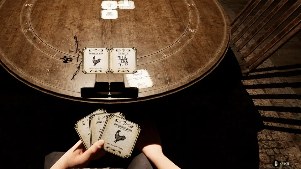 The Graveyard opened up mid turn, with a Chicken Decor and a Tic Tac Toe clue card sitting in it and a hand of three cards held below.